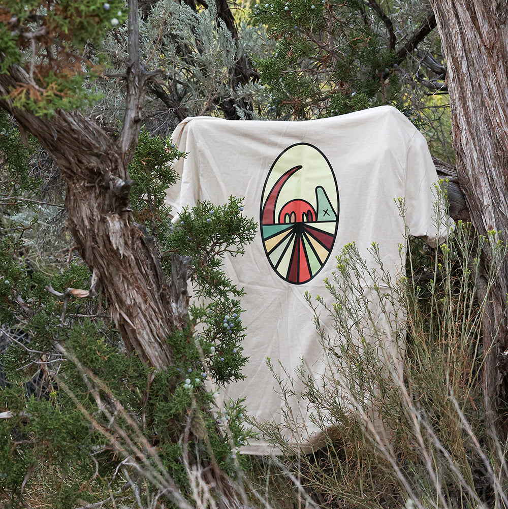 Tan Armadillo Tee hanging on Branch