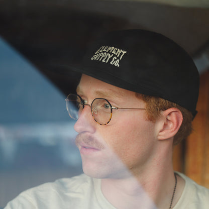 Model with Black Logo Hat