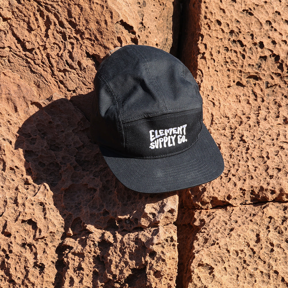 Black Logo hat in nature